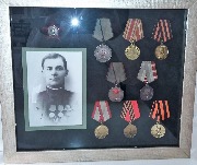 Оформление боевых наград . Глубокая рама-короб, дающая возможность пространства . короб прклеен замшевым паспарту.